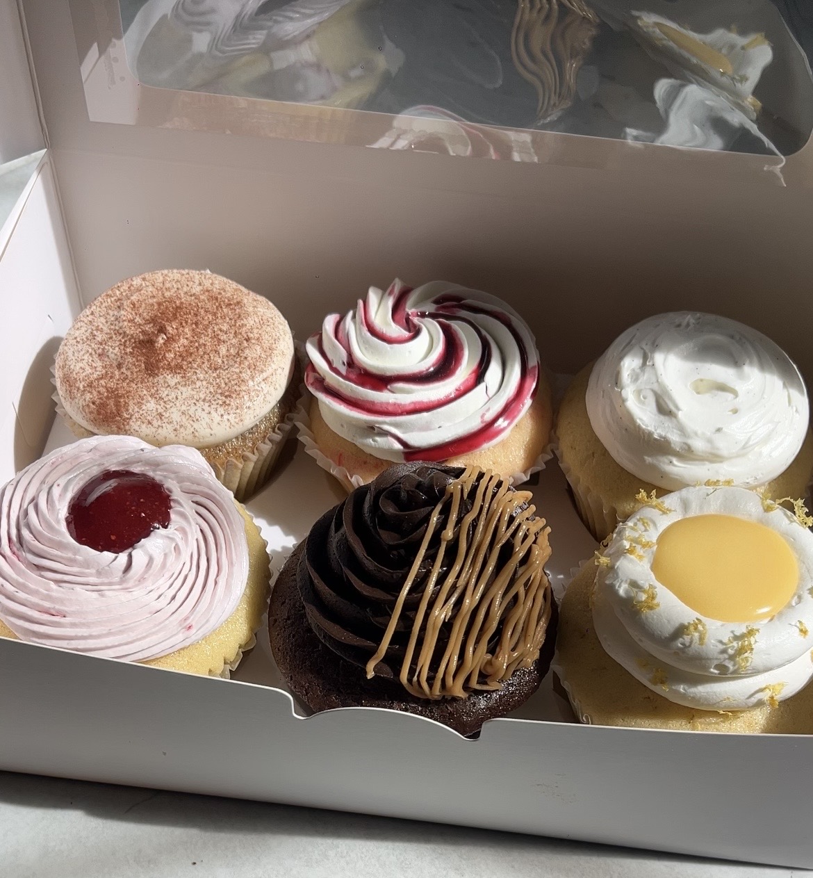A CHIPPY'S box of six assorted cupcakes